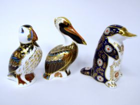 Three Royal Crown Derby Porcelain Paperweights; 'Brown Pelican', 'Platypus', and 'Puffin', all