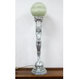 An Art Deco Style Chromed Table Lamp, modelled in the form of a naked lady, her arms held high to