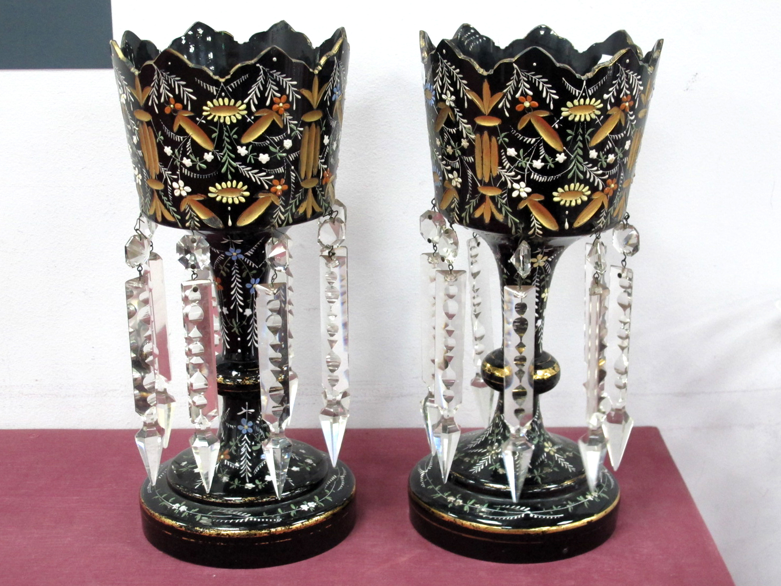 A Pair of XIX Century Table Lustres, in black opaque glass, each painted in enamels and gilt with