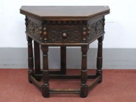A XVII Century Style Credence Table, with fold-over top, single drawer and carved frieze on turned