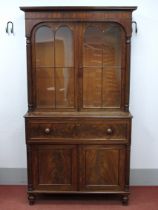 A William IV Mahogany Secretaire Bookcase, the top with arched glazed astragal doors with turned