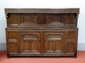 A Late XVII Century Joined Oak Court Cupboard, with carved frieze, panelled cupboard doors and