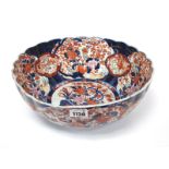 A Late XIX Century Japanese Pottery Bowl, of fluted circular form, decorated in the Imari palette