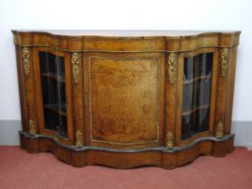 A Mid XIX Century Walnut Serpentine Shaped Credenza, with inlaid central door, glazed side doors, on