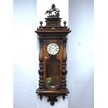 A XIX Century Walnut Two Weight Vienna Wall Clock, with applied pediment with a figure of a horse,