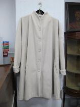 A c.1980 Mondi Pale Grey Wool Swing Coat, a Match Set pale blue linen coat and a Tricoville