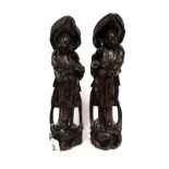 Two Late XIX Century Chinese Hardwood Figures, carved, each holding a bottle and a staff, standing