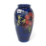 A Moorcroft Pottery Vase, of extended ovoid form painted in the 'Anemone' pattern with pink and