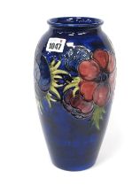 A Moorcroft Pottery Vase, of extended ovoid form painted in the 'Anemone' pattern with pink and