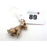 A 9ct Gold Novelty Poodle Pendant, of textured finish, with inset eyes (10grams).