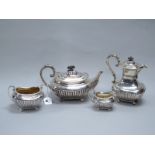 A Hallmarked Silver Four Piece Tea Set, James Dixon & Son, Sheffield 1911, each of semi gadrooned