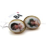 A Pair of Vintage Ceramic Panel Oval Earrings, each detailed with profile portrait, collet set on
