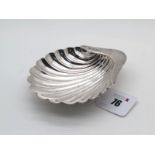 A Hallmarked Silver Shell Dish, HA, Sheffield 1911, raised on three shell feet (55grams). [667755]