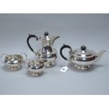 A Hallmarked Silver Four Piece Tea Set, Walker & Hall, Sheffield 1951, each of plain circular form