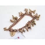 A 9ct Rose Gold Curb Link Charm Bracelet, to a heart shape padlock style clasp, suspending