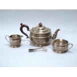 A Matched Hallmarked Silver Three Piece Tea Set, Bs, Birmingham 1928, 1929, each of plain circular