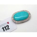 A Large Turquoise and Diamond Set Oval Panel Brooch, oval collet set within millegrain set border of