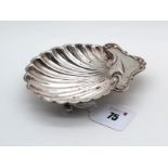 A Hallmarked Silver Shell Dish, London 1922, raised on three ball feet (75grams). [667754]