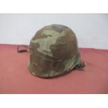 A Mid XX Century American M1 Combat Helmet.