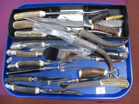 A Collection of Assorted Stag Horn Handled Knives, meat carving knives and forks, corkscrews;