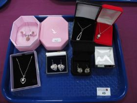 Modern Pendants on Chains, heart shape drop earrings, etc, all boxed.