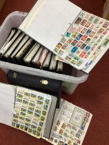 World stamps haphazardly mounted in eighteen albums, includes some duplication.