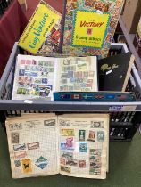 A carton containing an accumulation of worldwide stamps, stockbooks, junior albums etc.