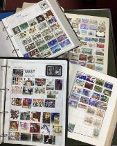 Stamps; A collection of world stamps, mainly modern, housed in four loose leaf albums, plus one