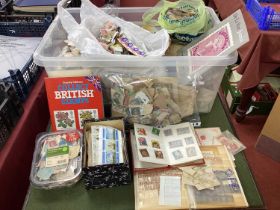 A Carton of GB, Commonwealth and World Stamps, in albums, plastic bags and boxes in and off paper,