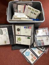 An Accumulation of over forty Great Britain first day covers in an album and some loose, a small