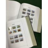 Stamps; a collection of mainly mint alderney stamps housed in two deluxe davo albums.