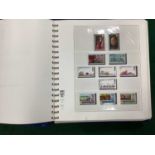 A Near Complete Collection of Jersey stamps from 1969 - 1995, housed in a deluxe loose leaf binder