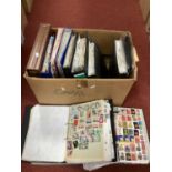 World stamps haphazardly mounted in ten albums plus a 'New Zealand stamp collection 1988' book and a