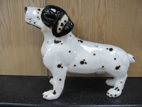 A large ceramic black and white spotted dog figurine 38cm h.