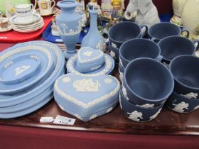 Wedgwood Jasper Ware, twelve dark blue tea cups, powder blue oval plates, vases etc:- One Tray.