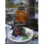 A XIX century platter dish, table lamp with amber glass shade on scroll feet, painted plaster head
