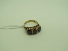 A 9ct Gold Three Stone Garnet Ring, of Victorian style (finger size N).