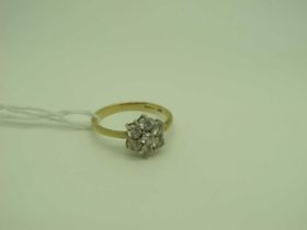 A Modern Diamonique Cluster Dress Ring, stamped "DQCZ 585" (finger size R).