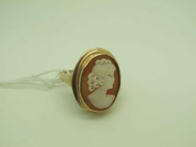 A 9ct Gold Oval Shell Carved Cameo Ring, oval collet set, depicting female profile.