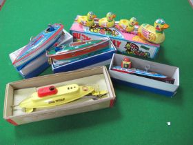 A collection of tinplate toys to include a boxed Sutcliffe Sea Wolf Atomic Submarine (no key),