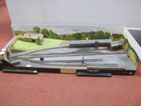 A scratch built "009" gauge model railway layout. Featuring points levers, platform sections, engine