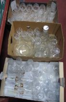 Glass punch bowl and ten glasses with etched design, together with some glasses from Stuart and