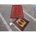 A Far Eastern Wool Rug, the centre with geometric flower head design within a geometric border, in