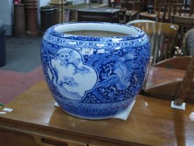 Oriental, large blue and white pottery, jardiniere, heavily decorated with exotic birds, prunus