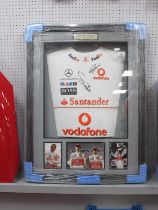 Lewis Hamilton & Jenson Button Autographs, black pen signed (unverified) on a Vodafone white shirt