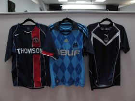 Football Shirts - Marseille, Adidas light blue with 'N9UF' logo. PSG Nike home 'Thomson' logo size