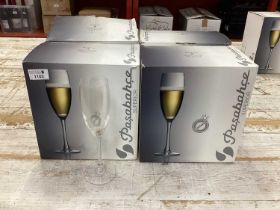 Four boxes of Pasabahce superior flutes. (One box with only 5 glasses )
