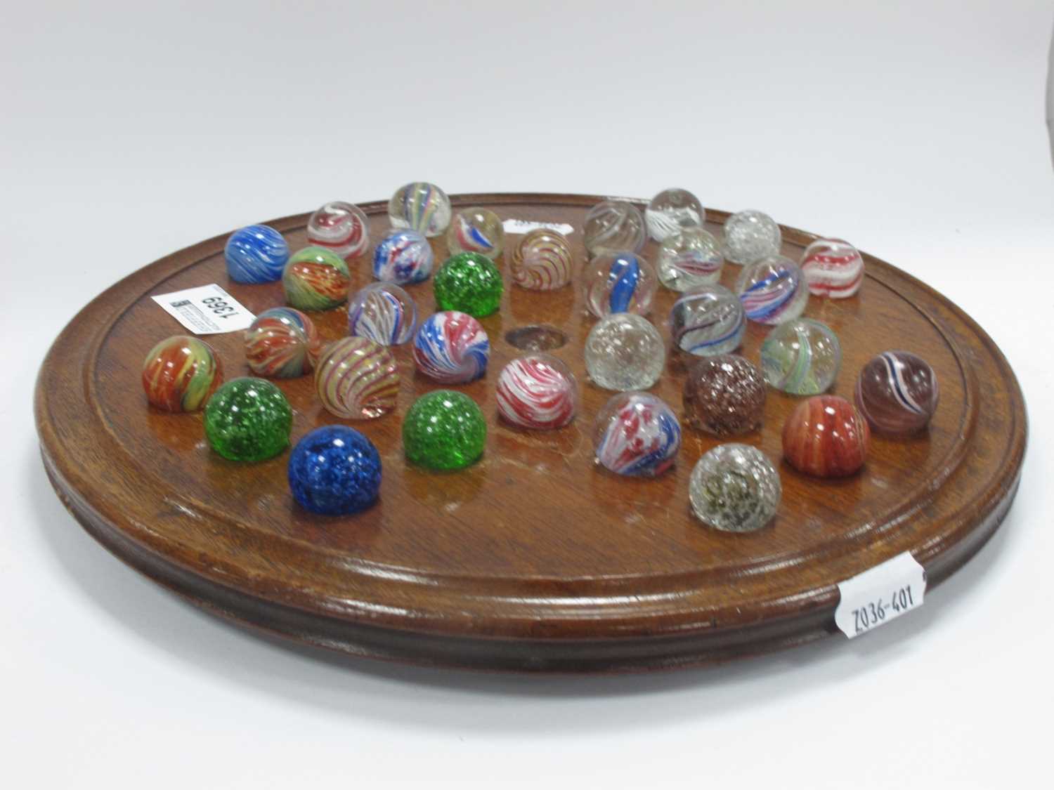 A solitaire board complete with Victorian marbles (32) dimensions board 27cm and all marbles about - Image 4 of 11