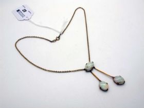 An Opal Negligee Pendant, oval cabochon set, on bar suspensions stamped "9ct", to 9ct gold chain.
