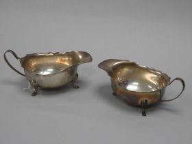 A Pair of Hallmarked Silver Sauce Boats, Adie Bros, Birmingham 1932, each with wavy cut edge, raised